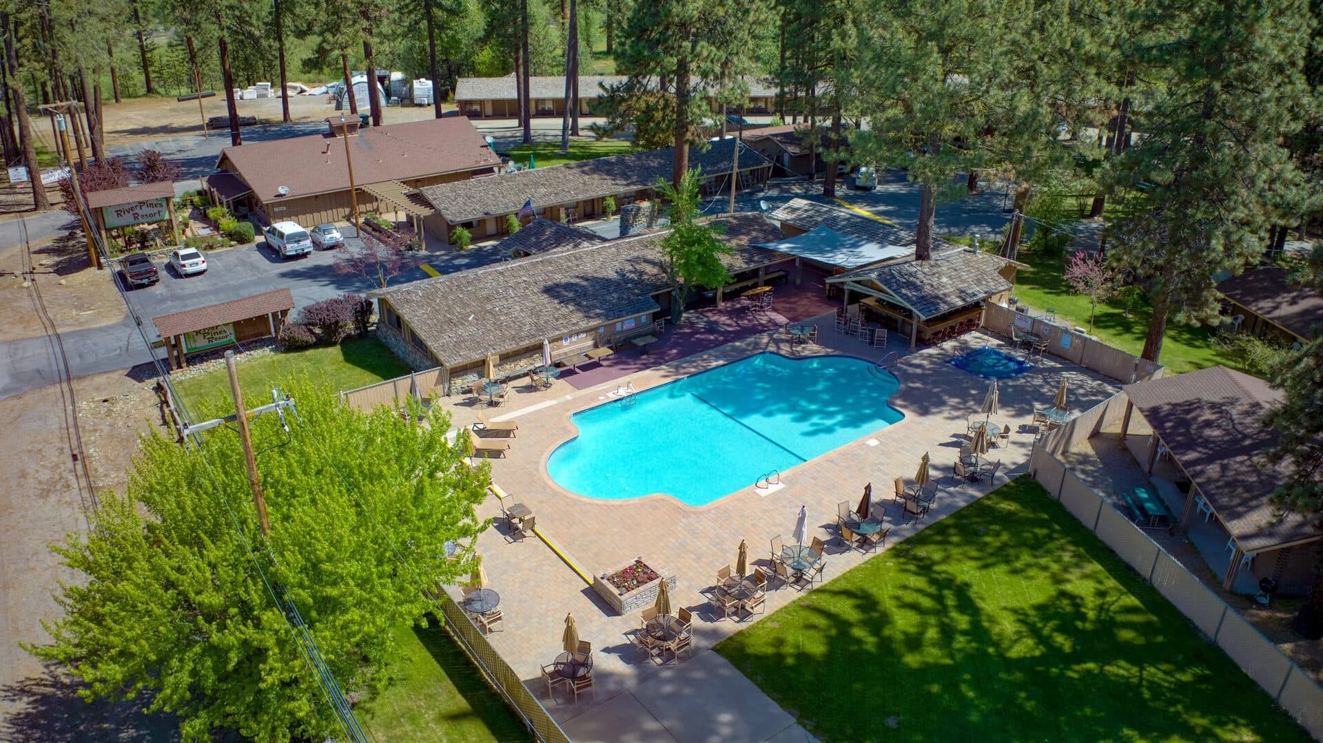 River Pines Resort aerial view of full property with pool and pine trees