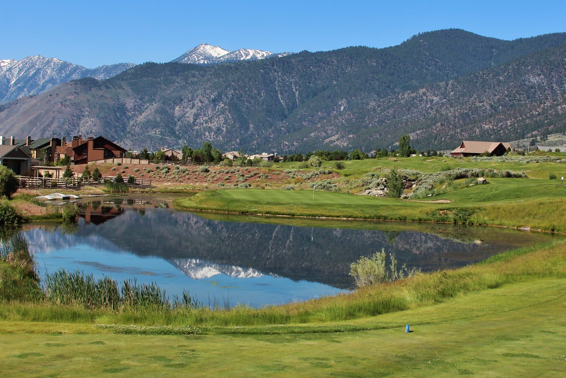 Hole 8 on the Ranch Course at Genoa Lakes — pond reflection with Sierra Nevada mountains Hole 8 on the Ranch Course at Genoa Lakes — pond reflection with Sierra Nevada mountains