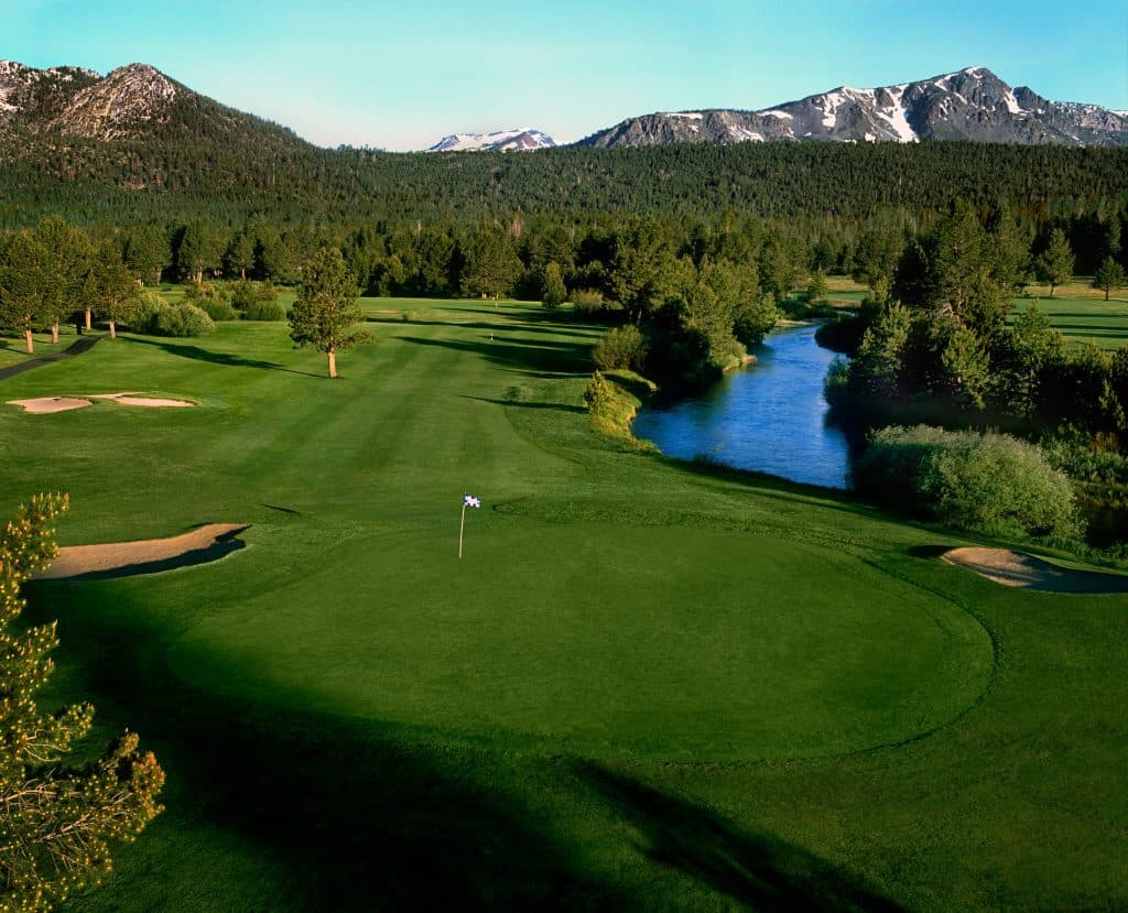 Lake Tahoe Golf Course — panoramic view of course with snow-capped Sierra Nevada peaks reflecting in pond Lake Tahoe Golf Course — panoramic view of course with snow-capped Sierra Nevada peaks reflecting in pond