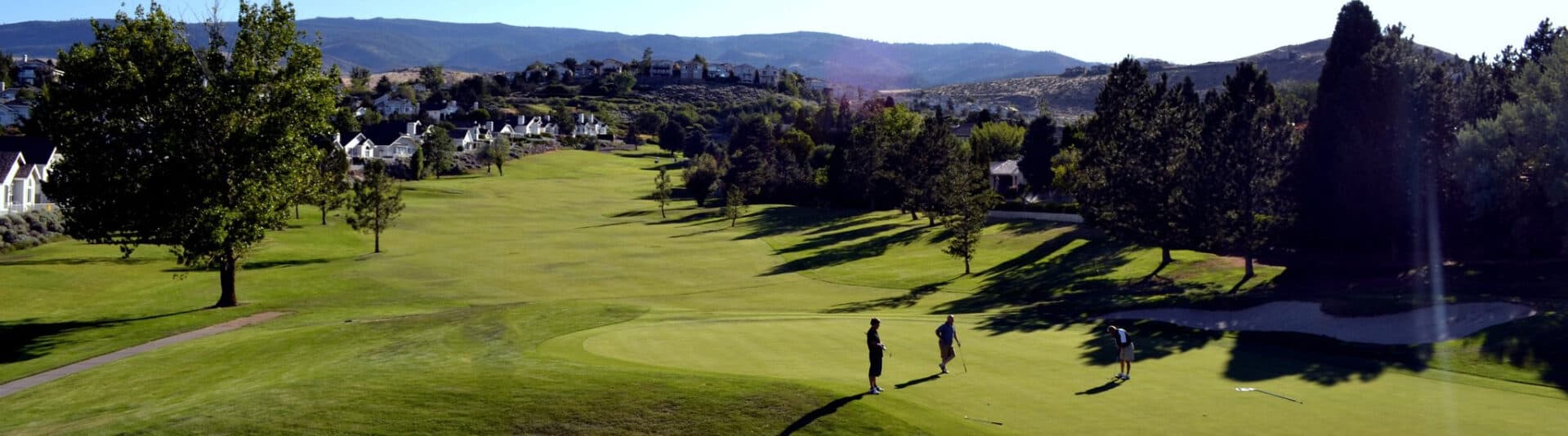 LakeRidge Golf Course fairway with Reno skyline visible in the distance LakeRidge Golf Course fairway with Reno skyline visible in the distance