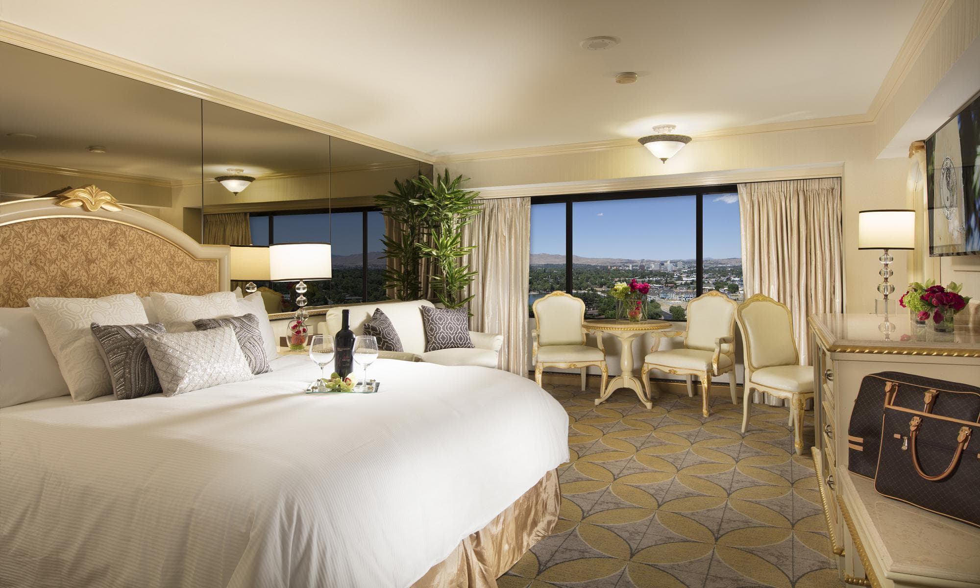 Peppermill Royal Suite at Peppermill Resort Spa Casino — bedroom with premium bedding