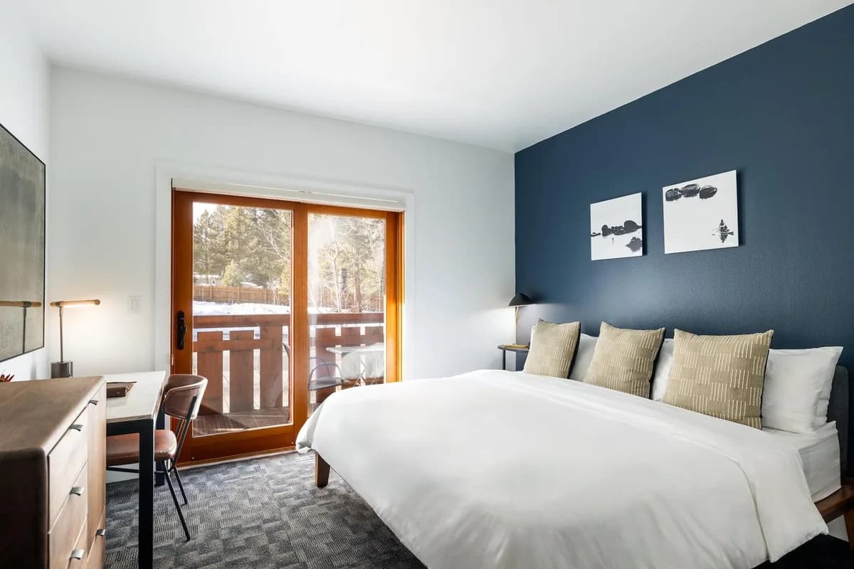 Gravity Haus Truckee guest room — modern mountain-contemporary decor with black-and-white ski-country photography