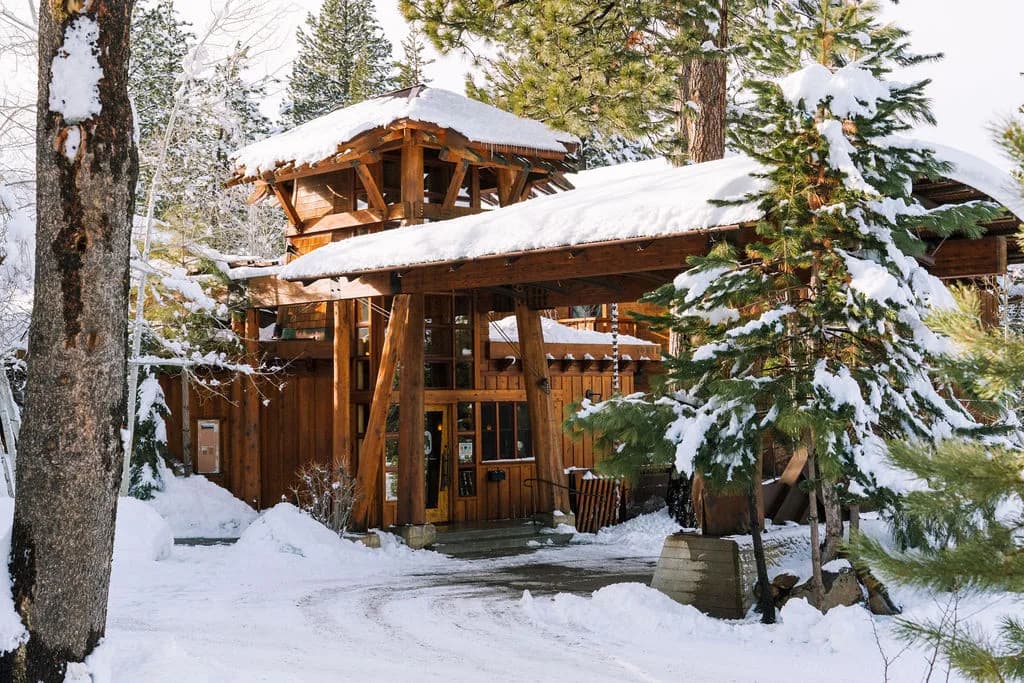 Gravity Haus Truckee-Tahoe exterior at dusk — mountain-modern lodge with warm illuminated windows in Truckee, CA Gravity Haus Truckee-Tahoe exterior at dusk — mountain-modern lodge with warm illuminated windows in Truckee, CA