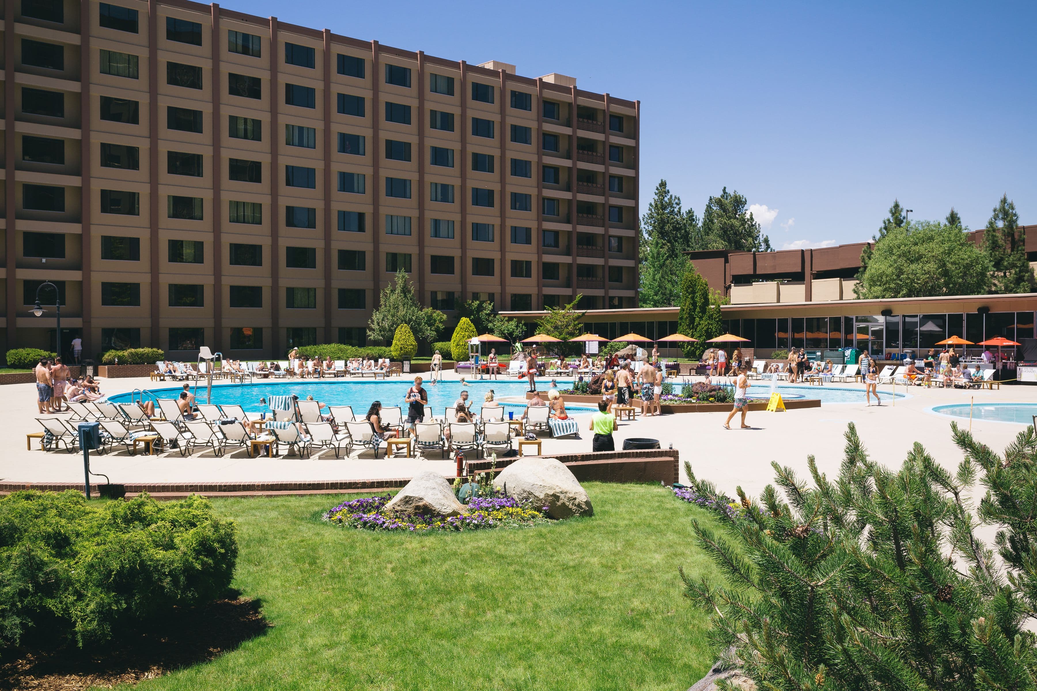 Outdoor pool at Golden Nugget Lake Tahoe with lounge chairs and resort grounds