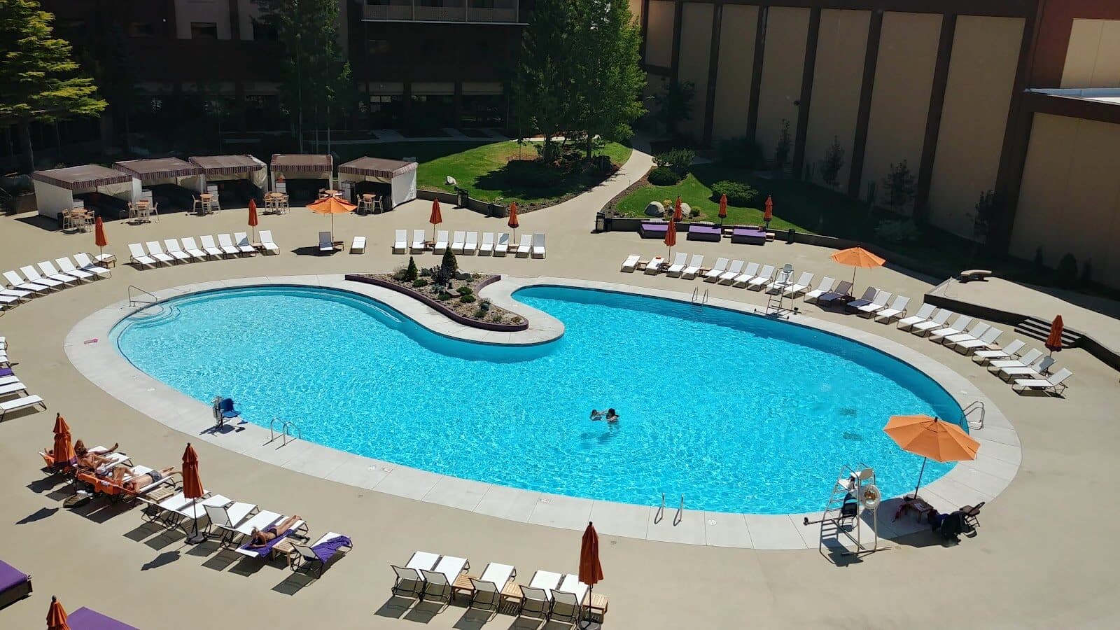 Outdoor pool at Golden Nugget Lake Tahoe with lounge chairs and resort grounds