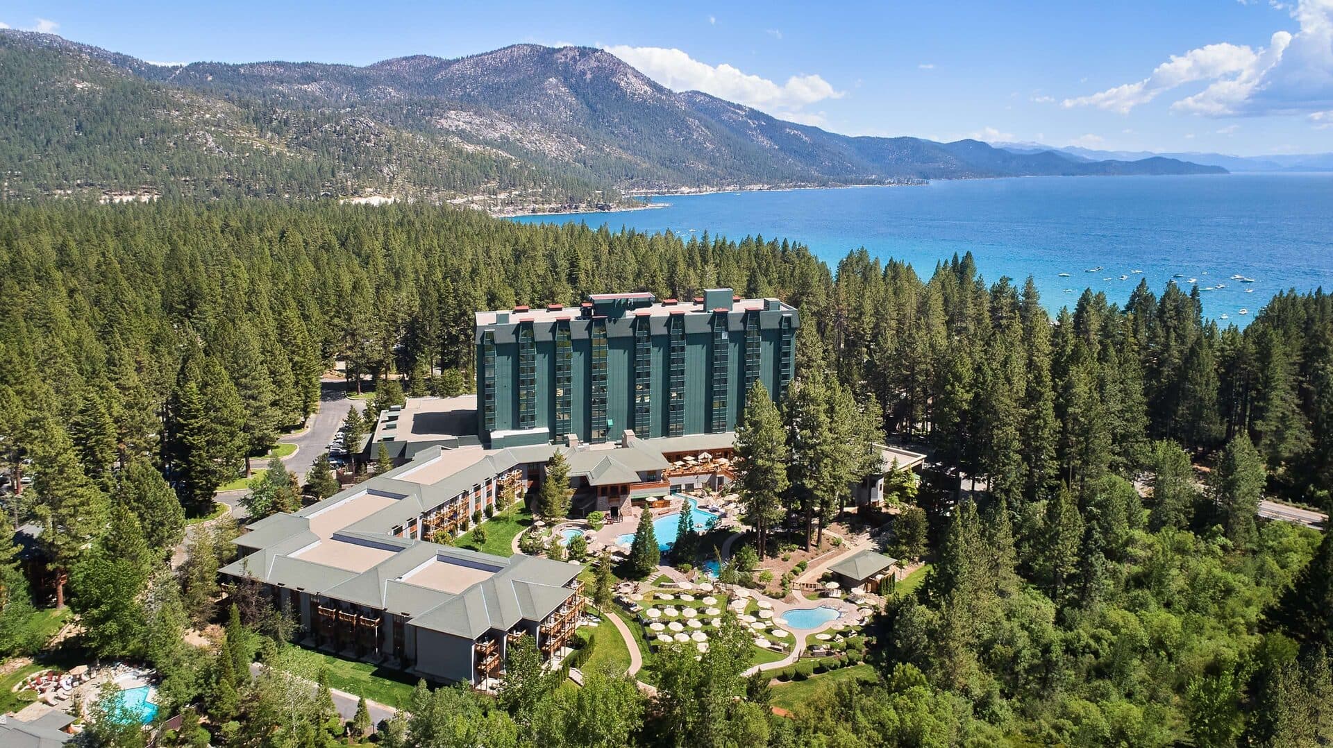 Hyatt Regency Lake Tahoe — aerial view of resort at Incline Village with Lake Tahoe and the Sierra Nevada mountains behind Hyatt Regency Lake Tahoe — aerial view of resort at Incline Village with Lake Tahoe and the Sierra Nevada mountains behind