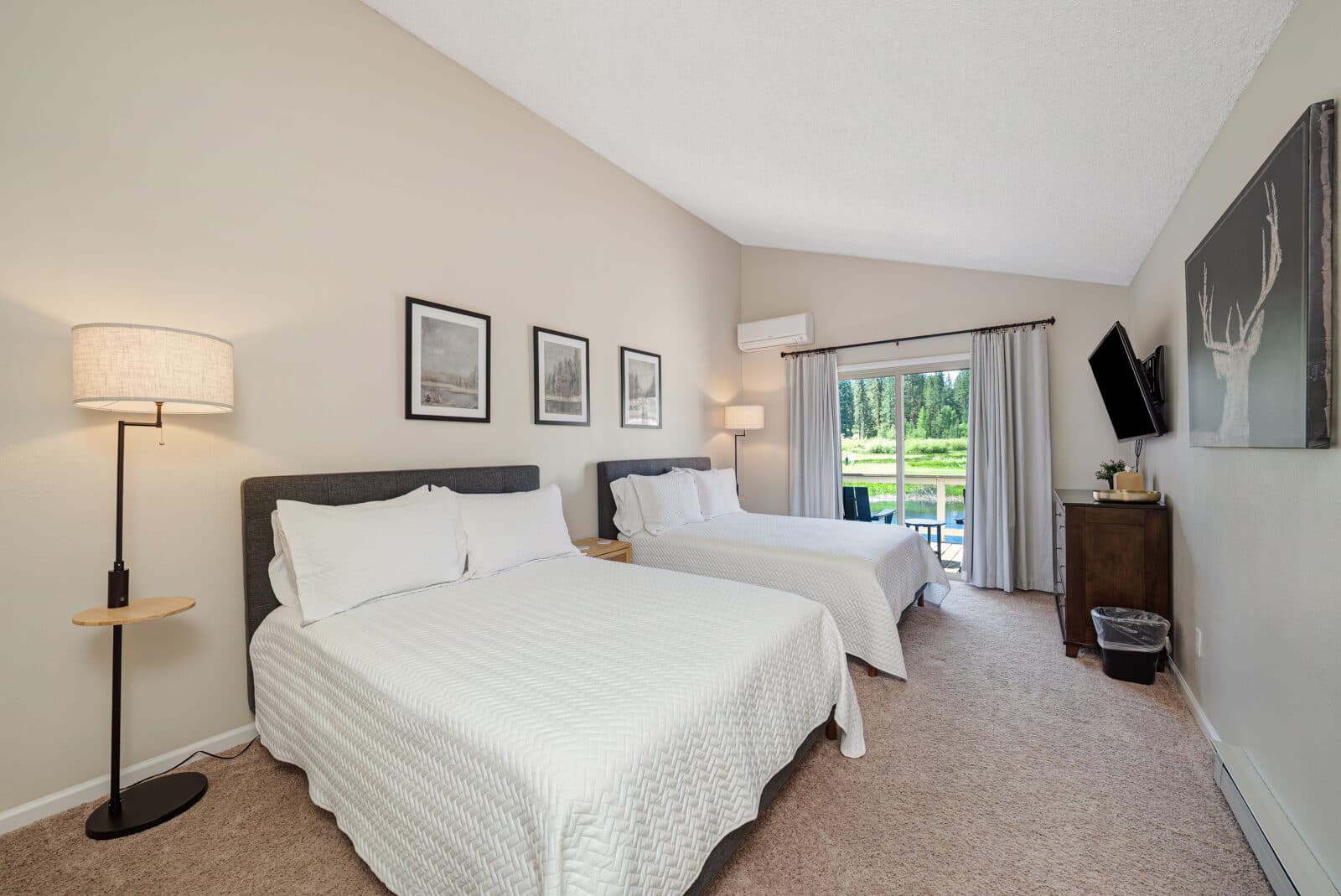 Bedroom with two beds and golf course views at Plumas Pines townhome in Graeagle CA